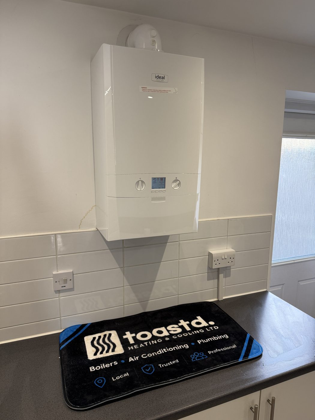 New Ideal combi boiler fitted in the same spot, kitchen wiped down